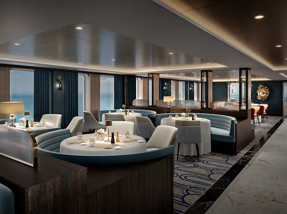 Imagine waking early in a suite where a full-height window swings open to a soft sea breeze.